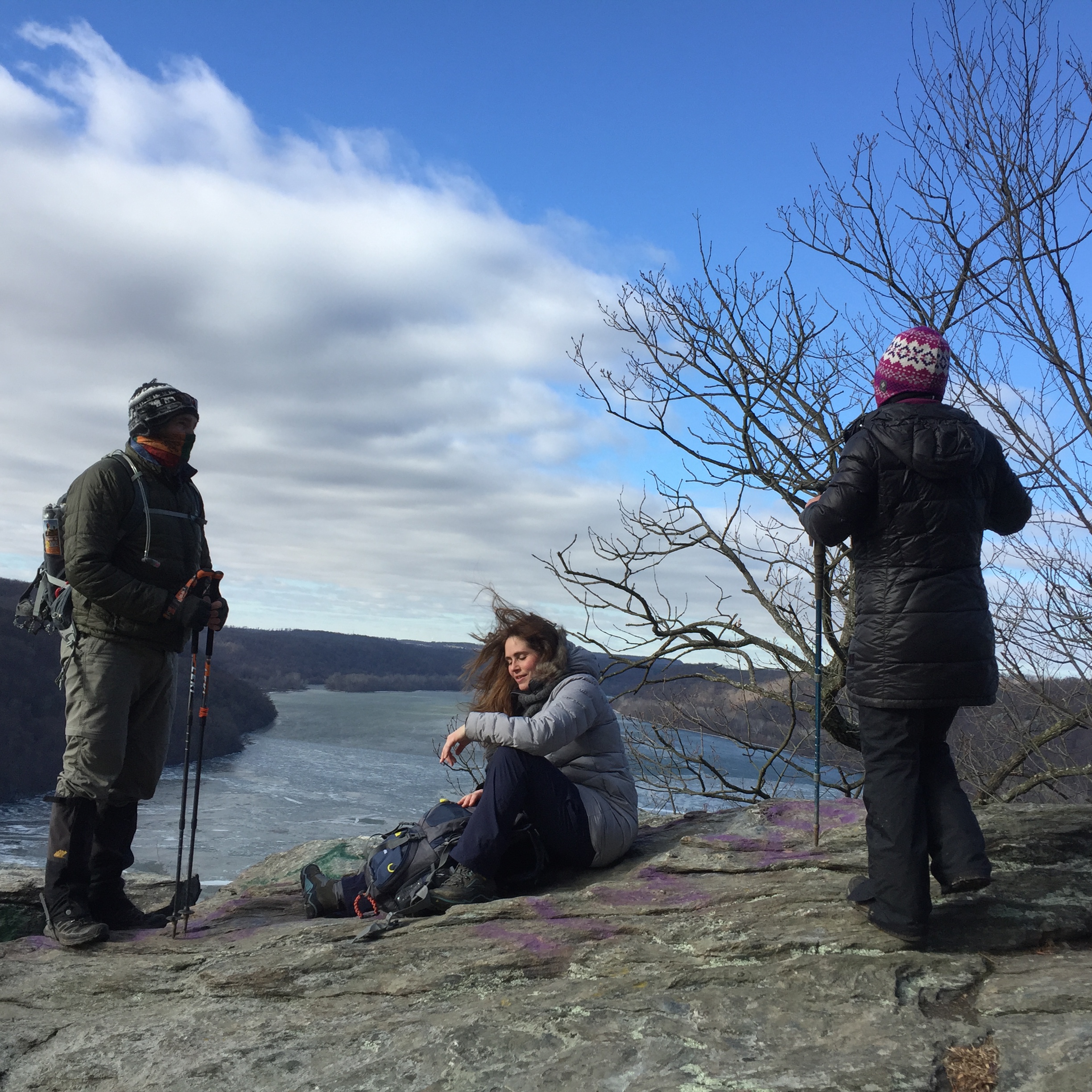 a group of hikers take a break at a vista