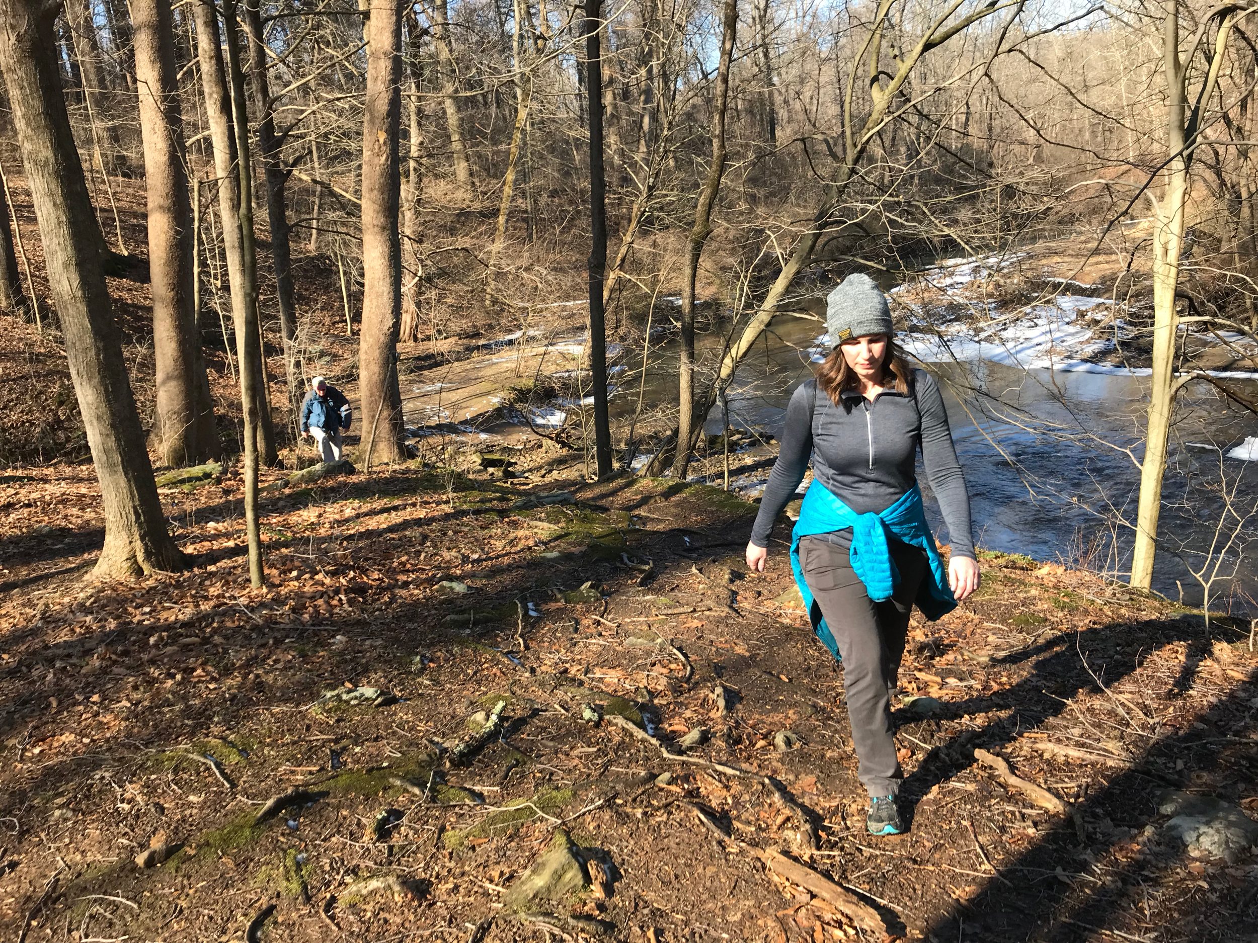 A group hiking up a hill at Ridley Creek State Park