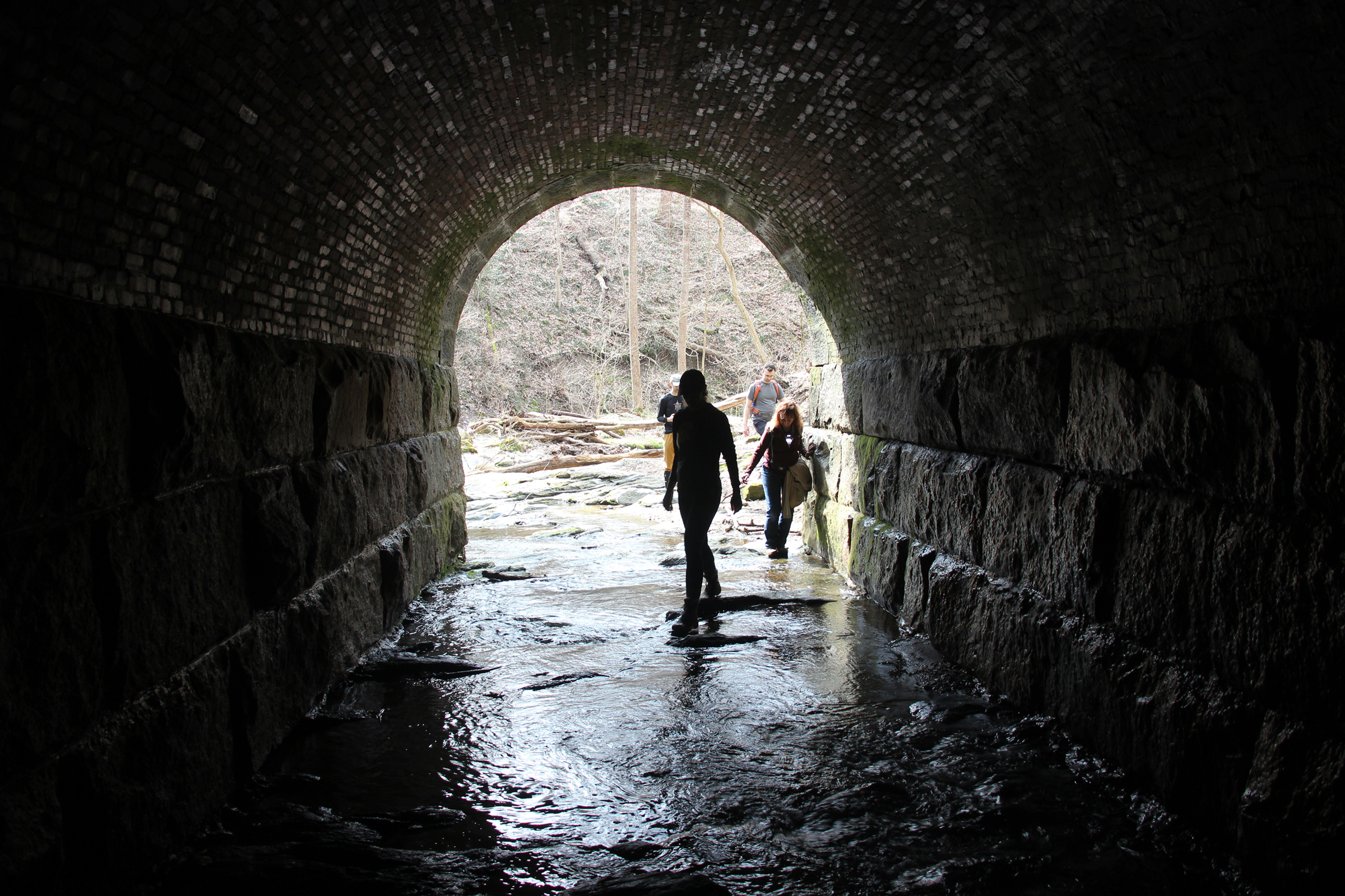 hikers in tunnel