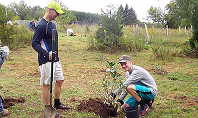 AMC Delaware Valley members planting trees during a conservation event. 